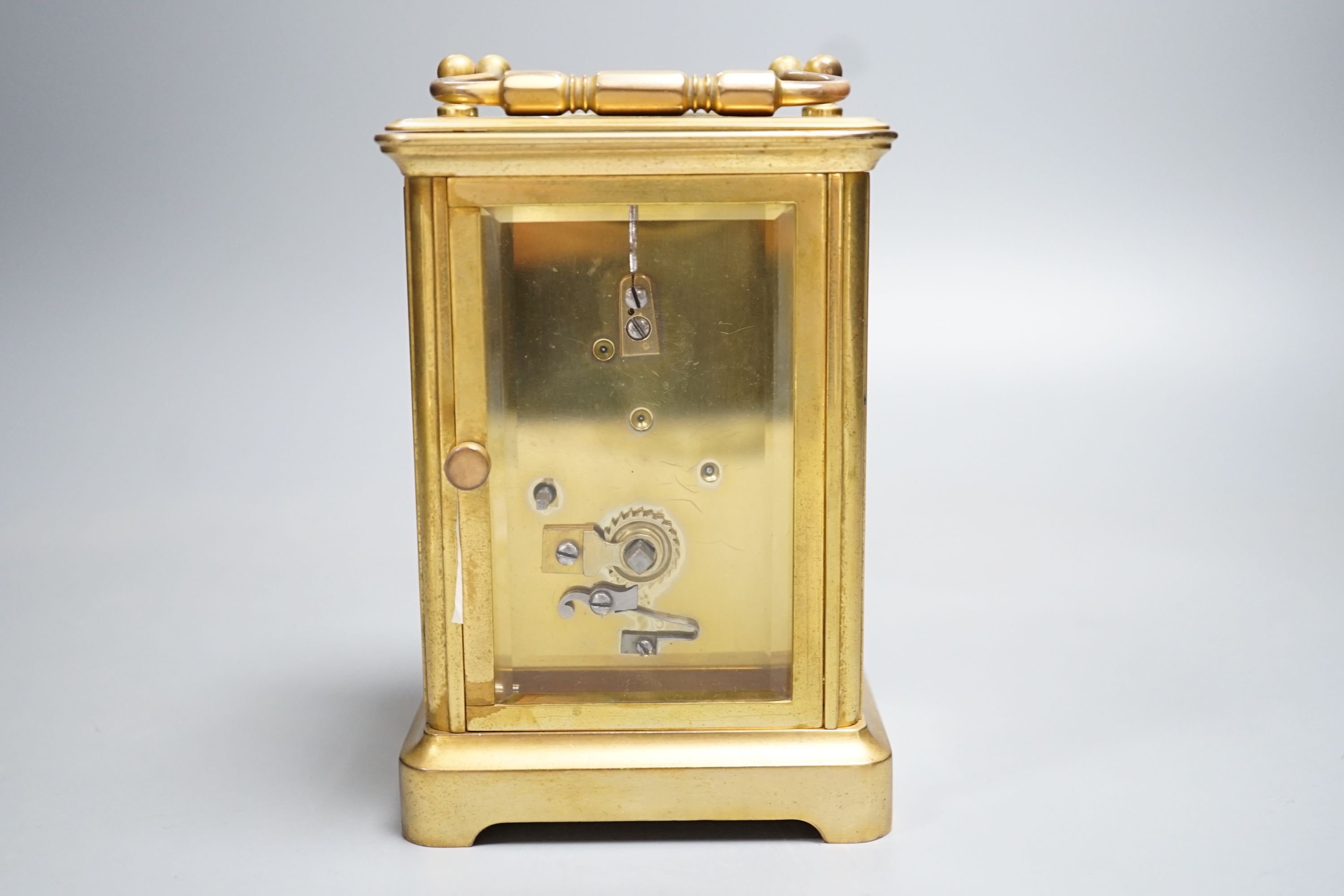 A late 19th century French brass carriage timepiece, the dial enamelled with chickens and foliage. 13.5cm (handle down)